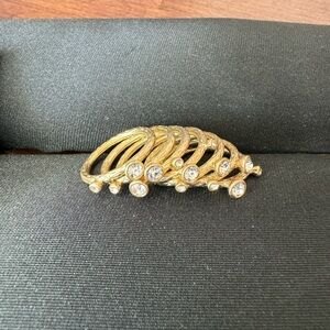 Gold tone ring stack (7 rings total) with crystal